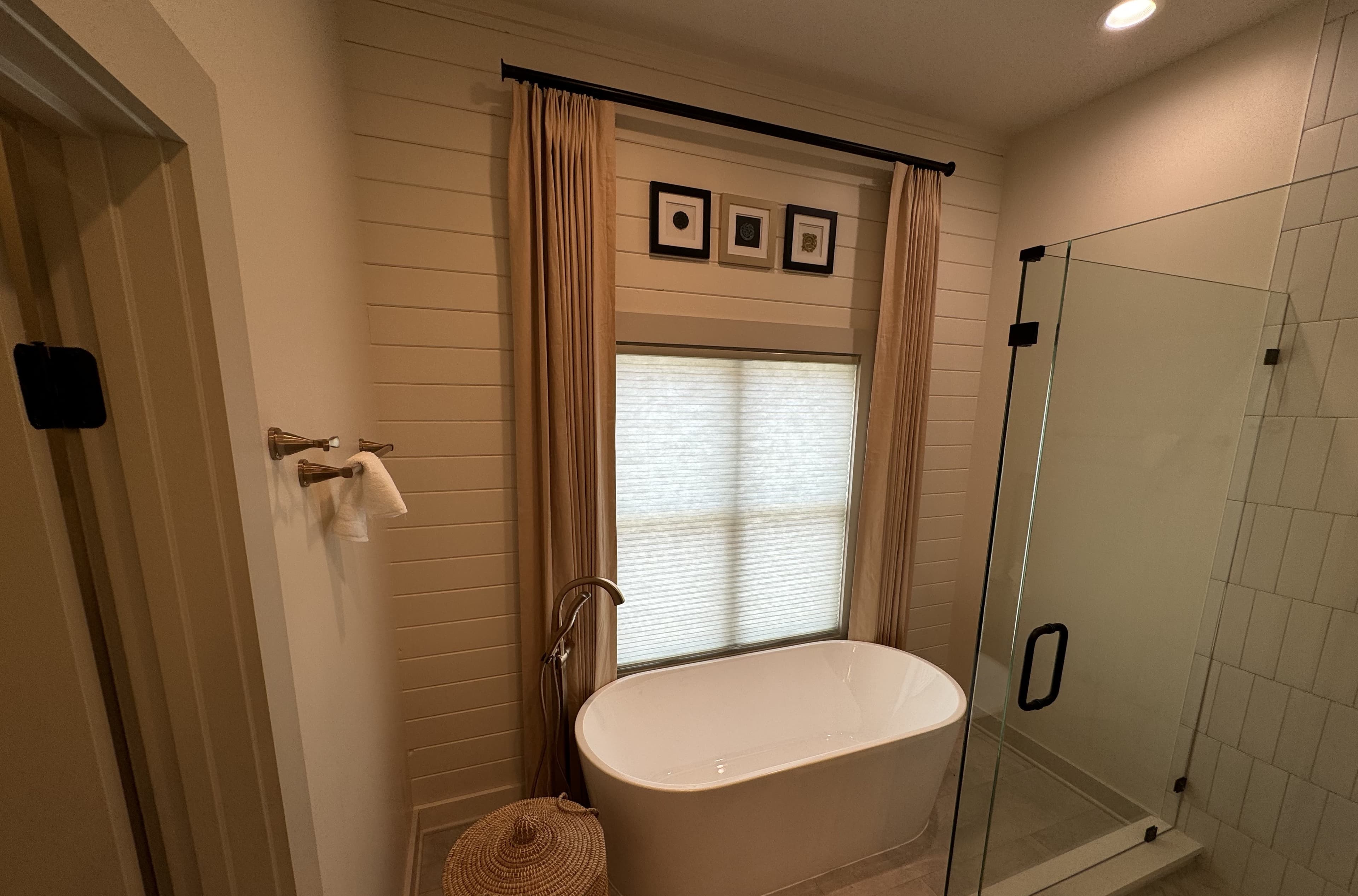 Custom bathroom with freestanding soaking tub and walk-in shower by S&T Construction